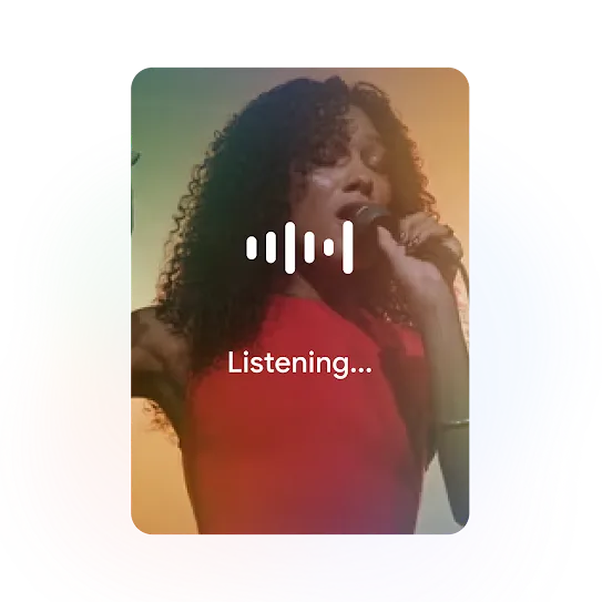 A person holding a mic and signing is used as an example for the song finder capability for Circle to Search.