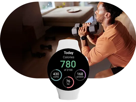 In the foreground, a smartwatch shows the MyFitnessPal app open with today’s calorie count displayed. Behind it, a person lifts weights.