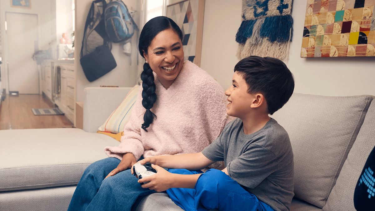 A mother and son playing games together